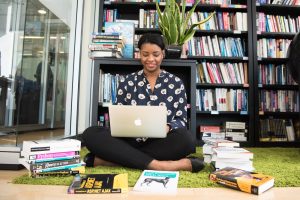 Woman in Black Shirt Using Macbook